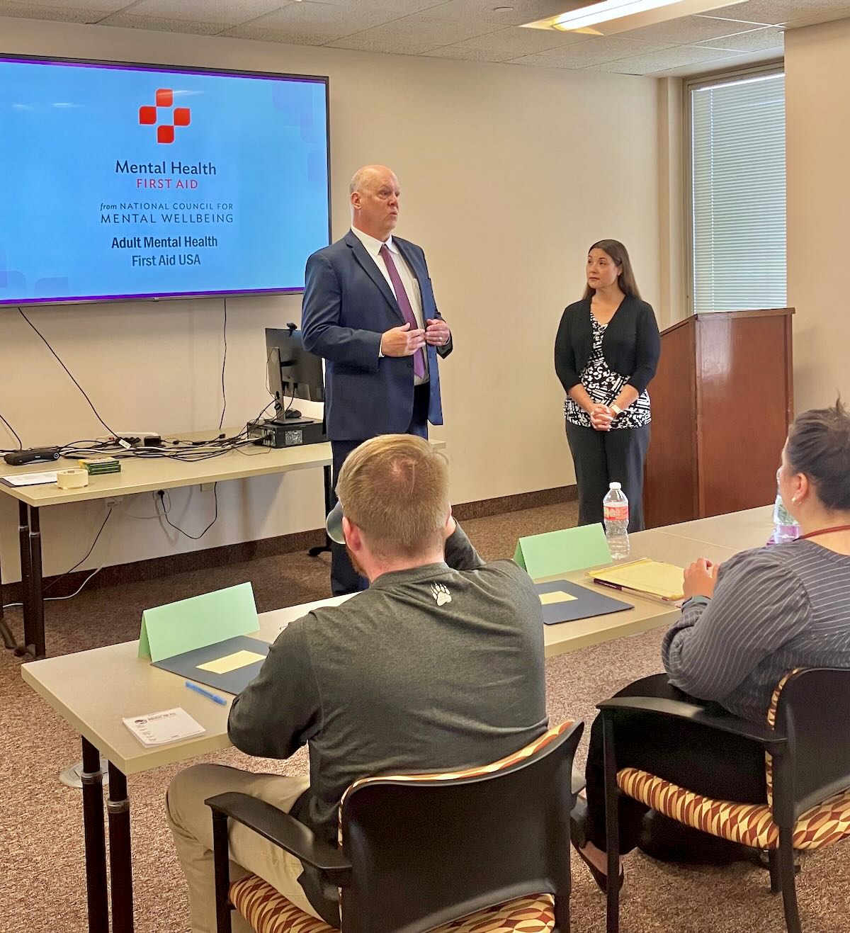 Oneida County Director of Health Dan Gilmore and Montgomery County Public & Mental Health Director Sara Boerenko address Oneida County Health Department employees during a Mental Health First Aid training session at the Oneida County Office Building in Utica on June 6, 2023.