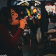 2024, Natalie Figueroa singing “Walking on Sunshine” at PiNZ for the band SpeakerBoxx. Photo by Lazore Photography.