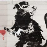 Banksy, May 2010, Haight Street Rat, Aerosol—Stencil on Redwood Siding, 79.5” (H) x 101.5” (L) X 2.75” (D). On loan from 2:32AM Projects, Thousand Oaks, CA