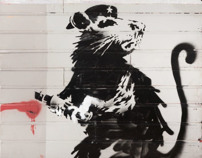 Banksy, May 2010, Haight Street Rat, Aerosol—Stencil on Redwood Siding, 79.5” (H) x 101.5” (L) X 2.75” (D). On loan from 2:32AM Projects, Thousand Oaks, CA