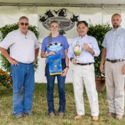 The F. Ambrose Clark Livestock Cup Winner: Mikaylee Woodin of Walton, NY showing her Market Hog “Grunkle.” Also pictured: Clyde Cranwell and Ben Williamson, Livestock Judges, and Paul D’Ambrosio, President & CEO of The Farmers’ Museum.