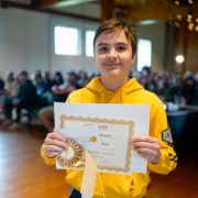 Kirill Grechkin accepts the Grand Prize Award for his drawing, The Moonlight Terror.