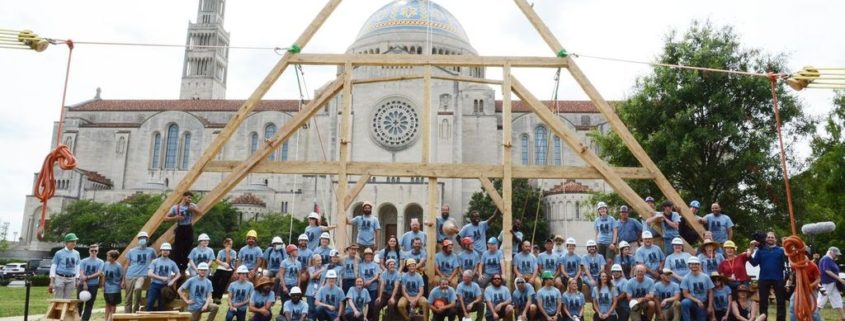 Group shot of the team that completed the first successful 'raising' of a replica truss at Catholic University of America (CUA) in August 2021; the team consisted of over 50 architects, carpenters, and students.