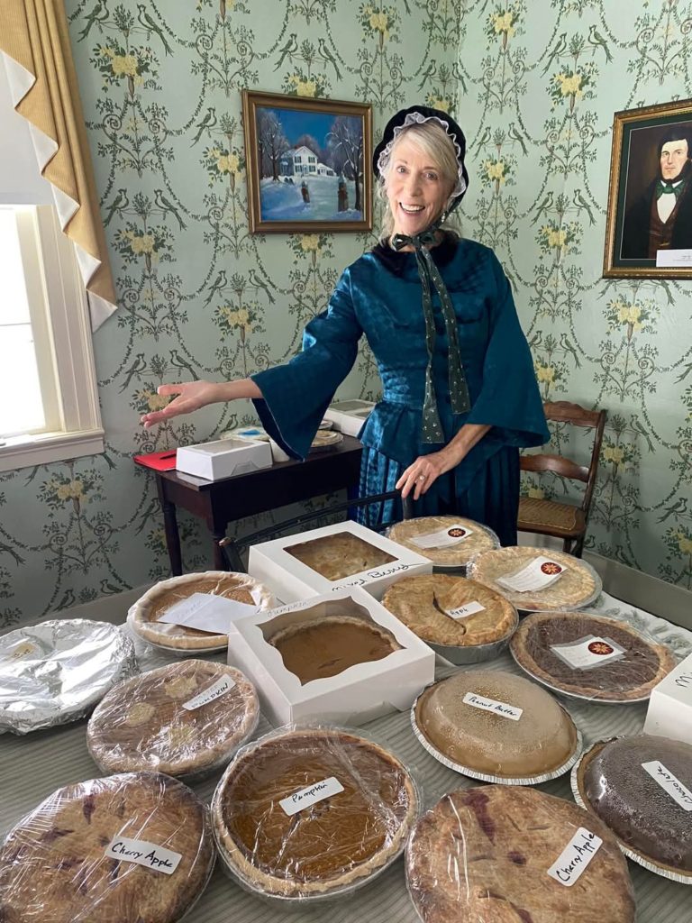 Carol Johnston working the Homemade Pie Sale at The Rice Homestead's Christmas Open House.