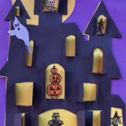 Sample cut-paper haunted house with shutters that open