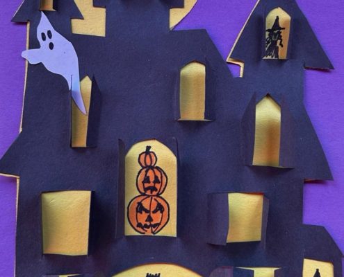 Sample cut-paper haunted house with shutters that open