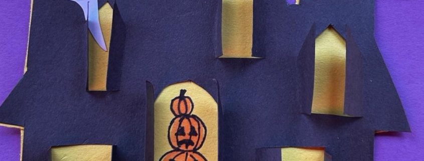 Sample cut-paper haunted house with shutters that open
