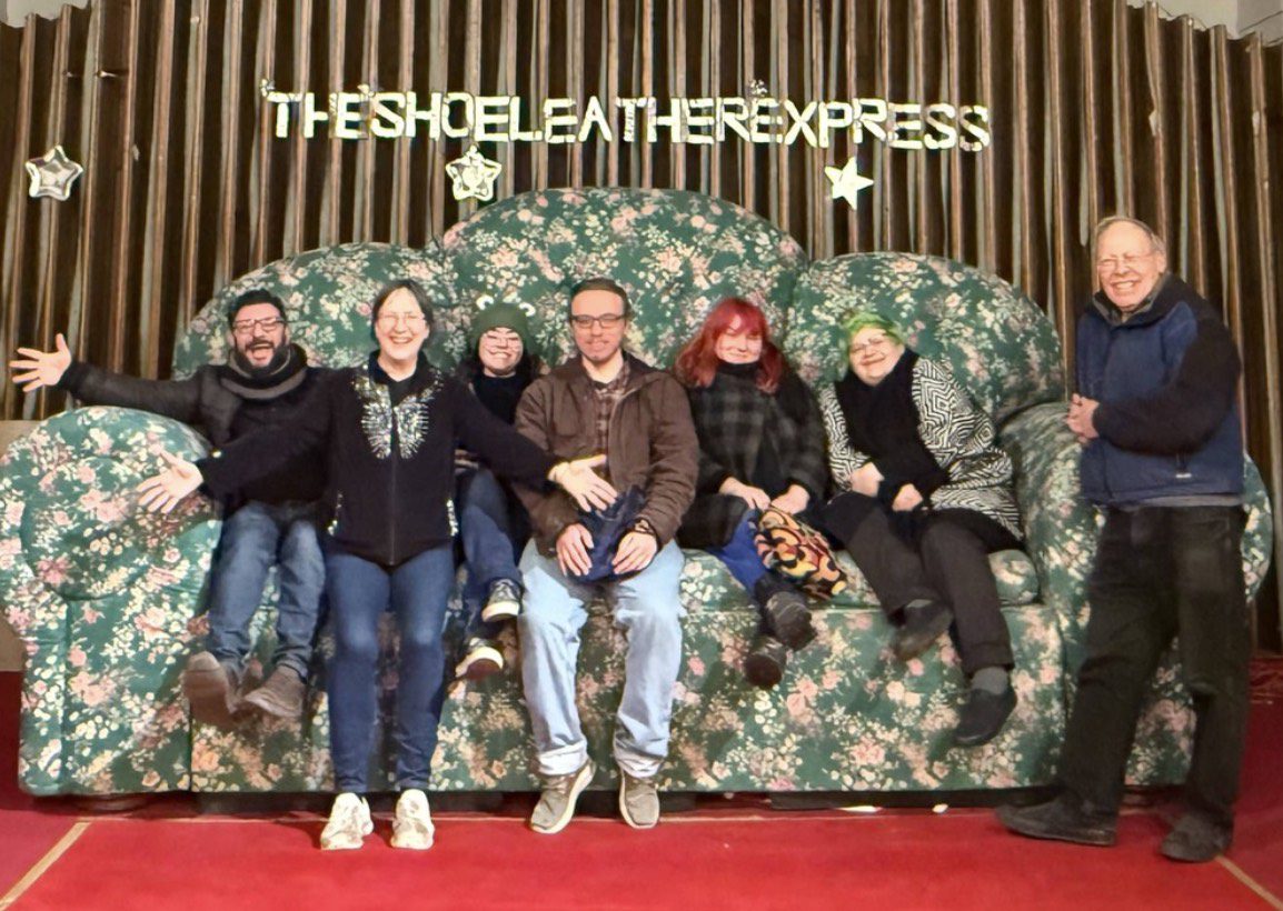 Image at Shoeleather Express: Pictured L to R: Michael Maricondi, Elaine Mikenas, Lichen King, Zachary Hayes, Lillian Nevins, Ashley Olmstead, Dennis Viscanti. Images provided by Trust Your Gut Productions. Image at Shoeleather Express: Pictured L to R: Michael Maricondi, Elaine Mikenas, Lichen King, Zachary Hayes, Lillian Nevins, Ashley Olmstead, Dennis Viscanti. Images provided by Trust Your Gut Productions.