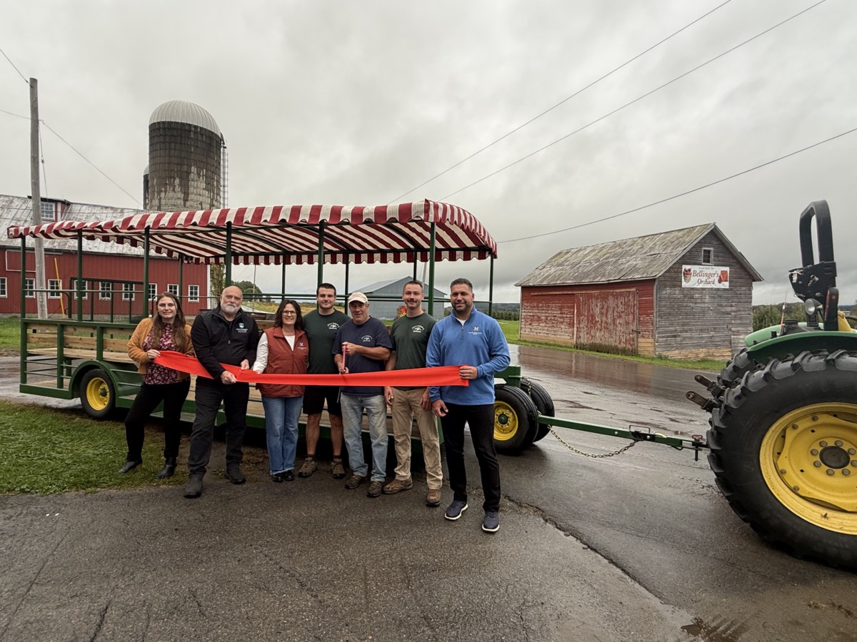 The Coyne family and County officials gather for a ribbon cutting celebrating the new accessible hay wagon at Bellinger’s Orchard. The Coyne family and County officials gather for a ribbon cutting celebrating the new accessible hay wagon at Bellinger’s Orchard.